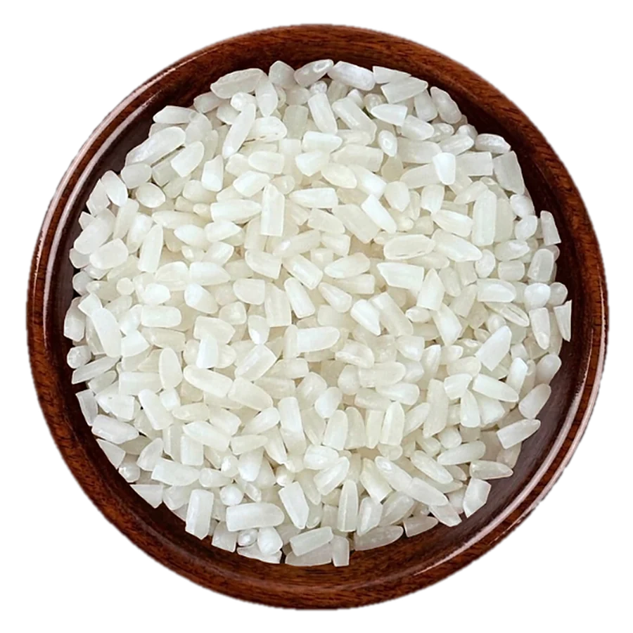 100% broken Rice in a wooden bowl, seen from above