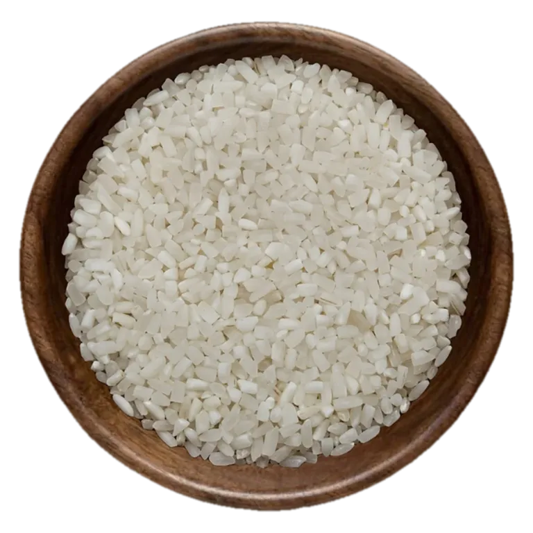 Close view of 100% broken Rice in a wooden bowl, seen from above