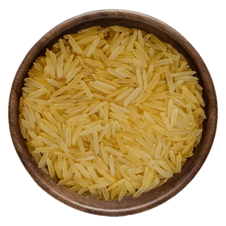 Close view of 1121 Basmati Golden Sella Rice grains in a wooden bowl, seen from above
