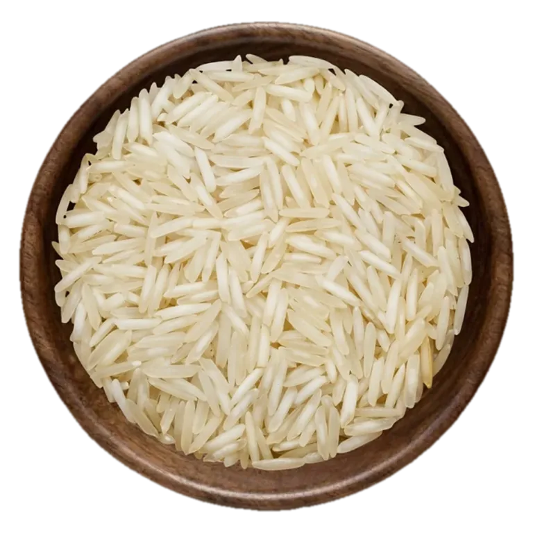 Close view of 1121 Basmati steam Rice grains in a wooden bowl, seen from above