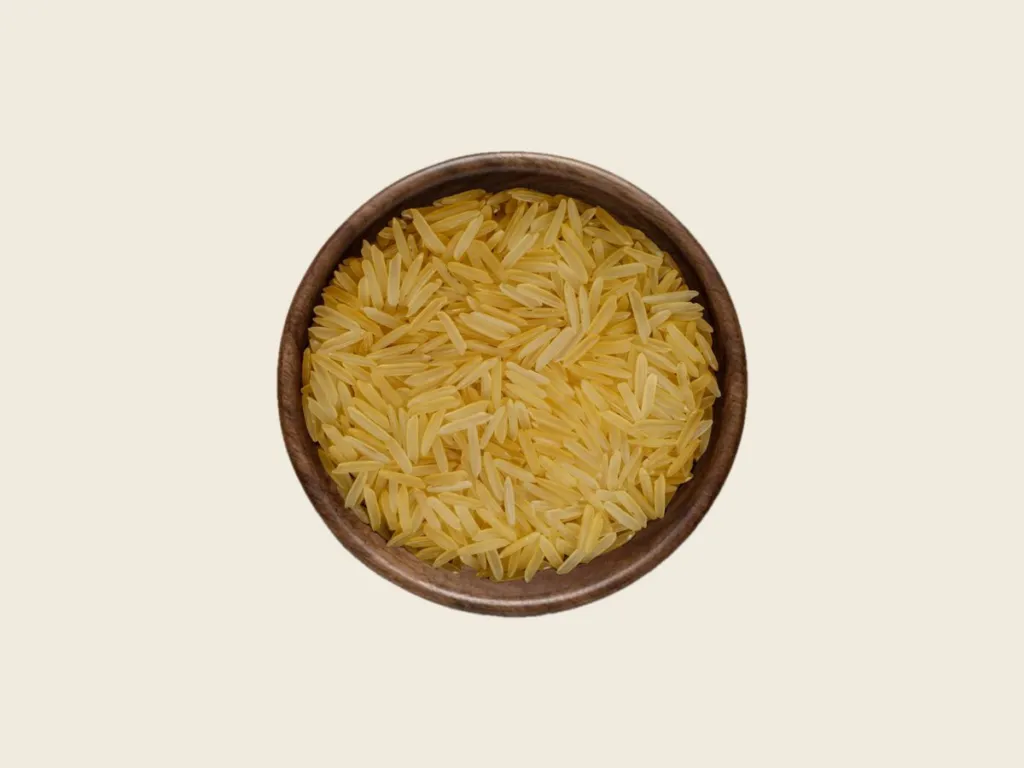 1121 Basmati Golden Sella Rice in a wooden bowl