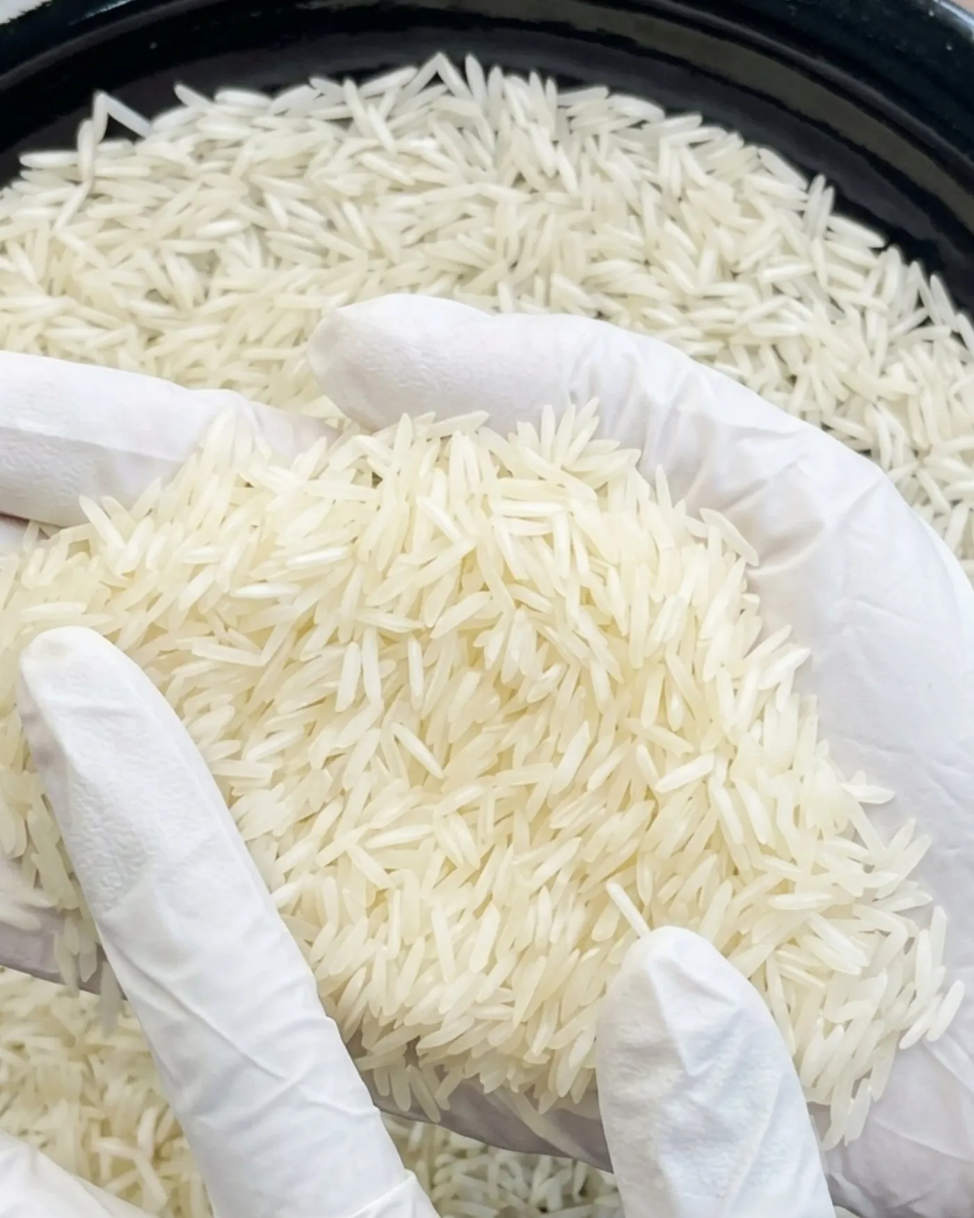 Milled Rice checked by hand before loading, one of the checks behind our certifications