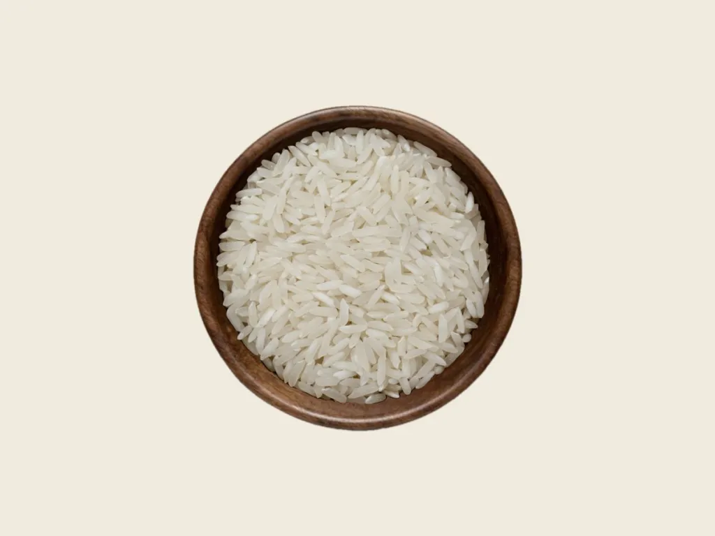 IRRI-6 long grain white Rice in a wooden bowl