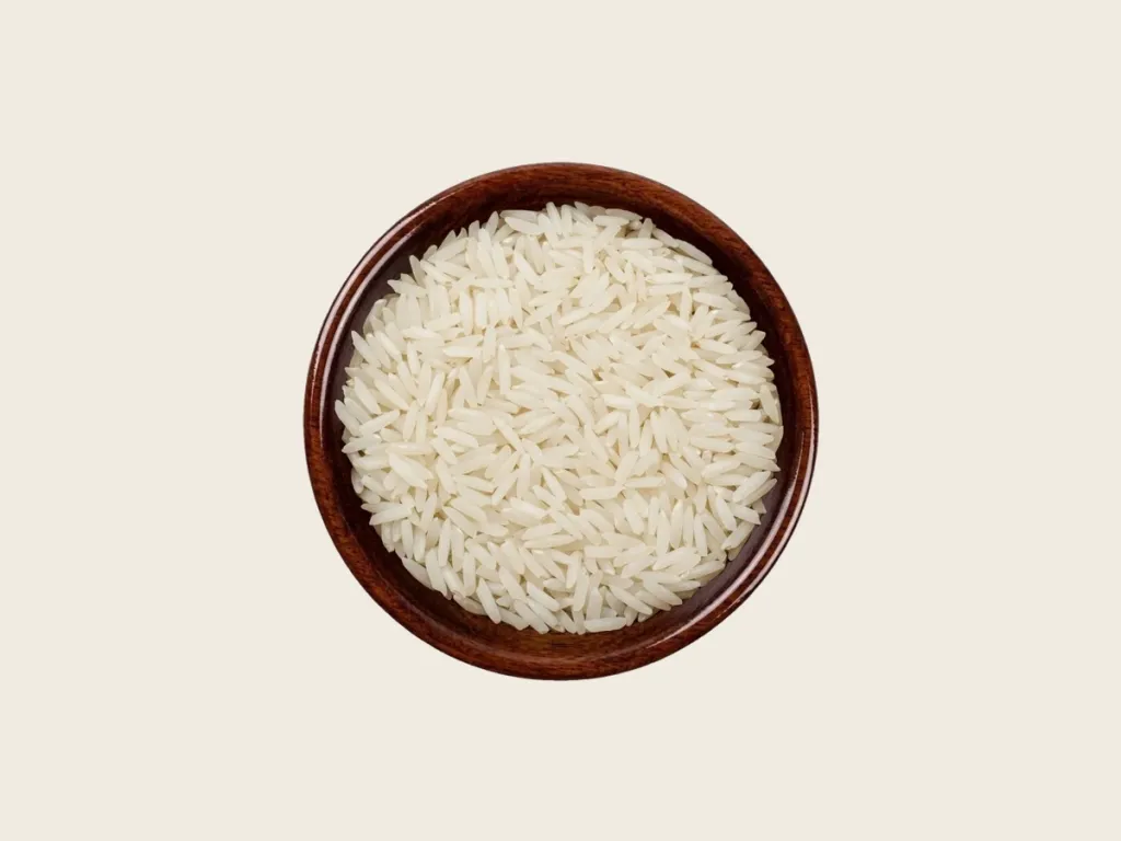 D-98 Basmati white Rice in a dark wooden bowl