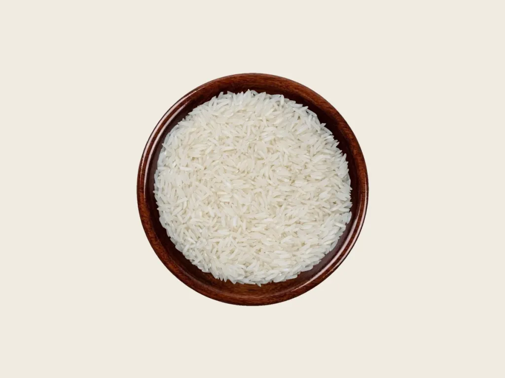 PK-386 white Rice in a dark wooden bowl